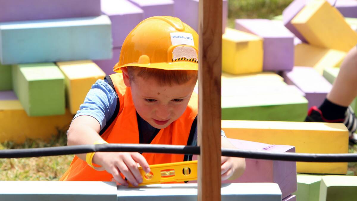 Ewan McClelland, 6, was consumed by the work at hand with his construction activity. Pictures: MARK JESSER 