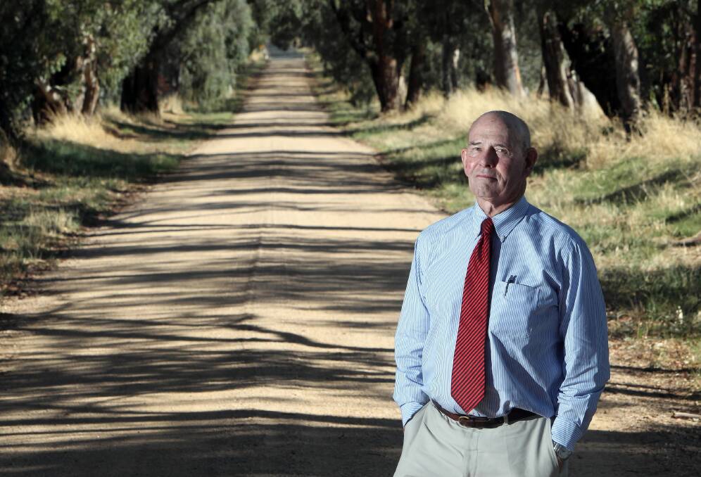 NRMA motoring and services director Graham Blight visits an unsealed section of Jindera's Luther Road. Picture: KYLIE ESLER