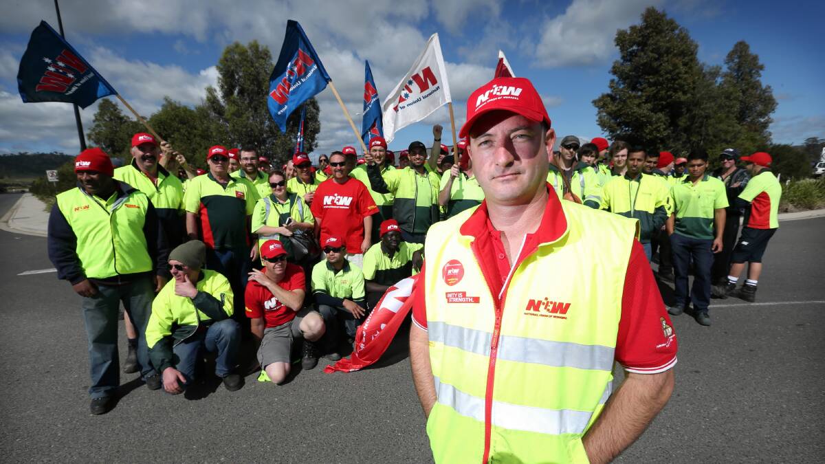 National Union of Workers representative Neil Smith with workers striking at the Woolworths Distribution Centre at Barnawartha North. Pictures: MATTHEW SMITHWICK