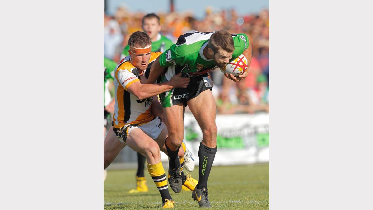 Albury's Lou Goodwin is grabbed by an opponent.