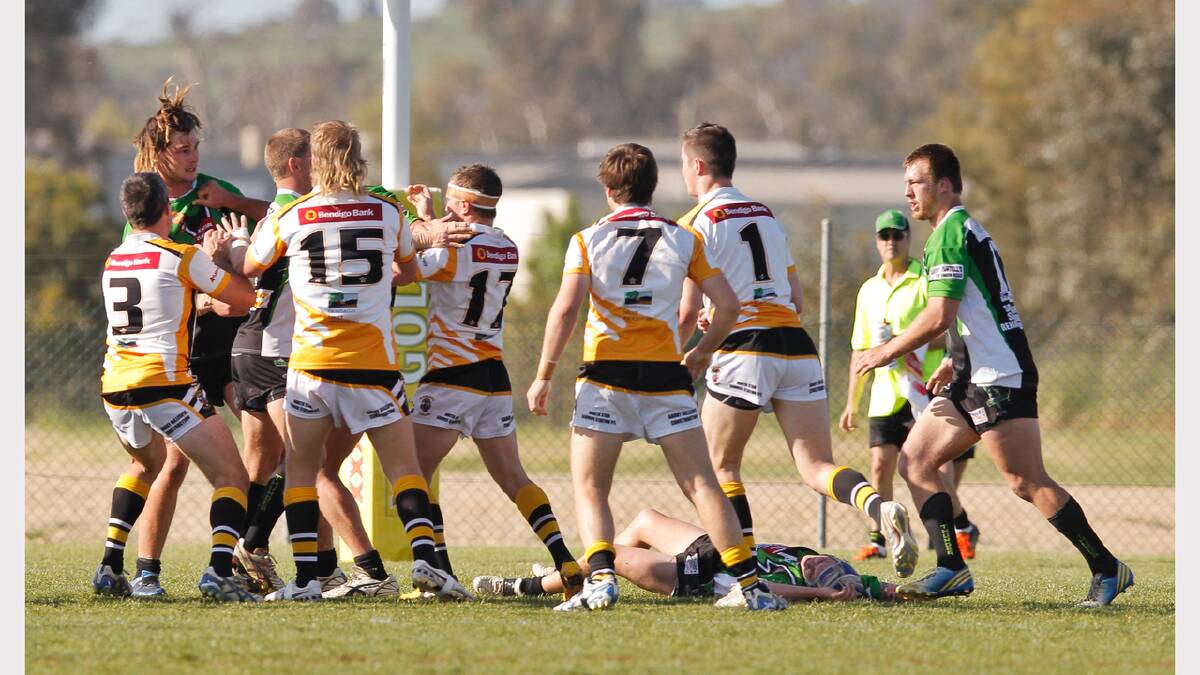  Albury's Mitch McLeod lays on the ground during a brawl.