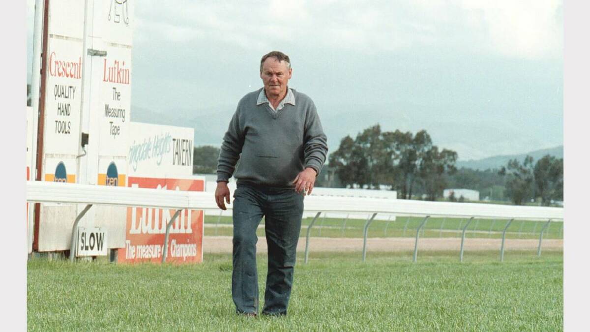 Albury Race Club curator walks the course after horrible weather cancelled the races, at a cost of $10,000. Picture: ALEX MASSEY