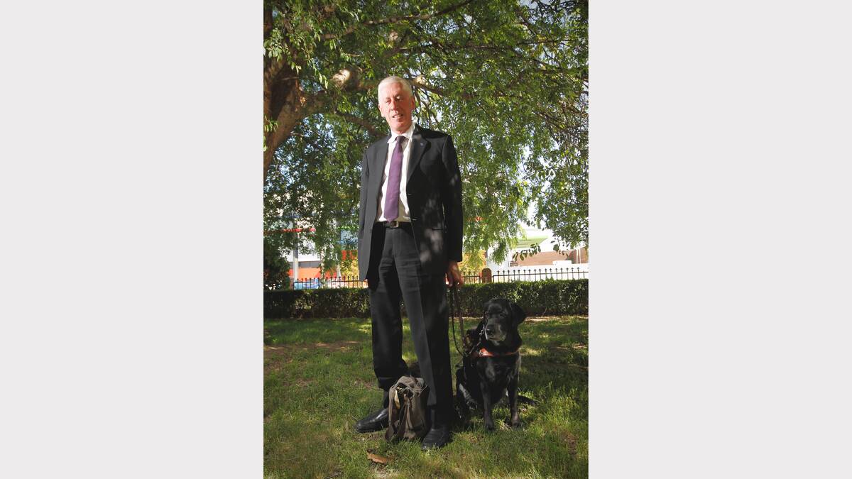 Disability Discrimination Commissioner Graeme Innes, pictured with his guide dog. 