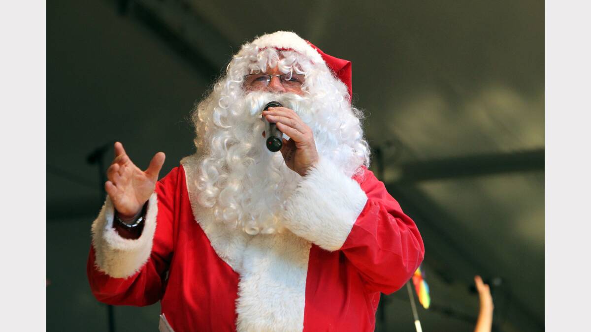 Santa performs for the crowd. 