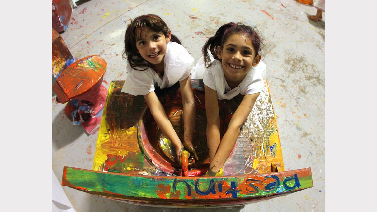 Aliyah Siddique, 6, and Amina Siddique, 5, weren't afraid of getting dirty while working on their painted desk. 