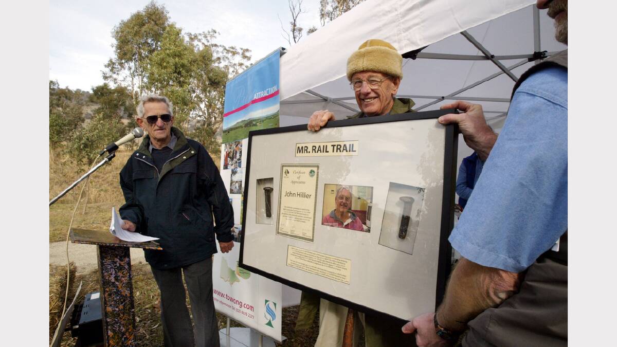 Cliff Swatton presented John Hillier with the "Mr Rail Trail" award. (2004)
