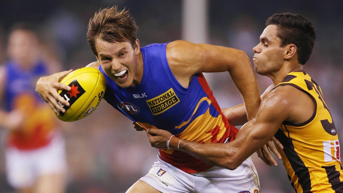 Dayle Garlett of the Hawks tackles Zachary O'Brien of the Lions. Picture: GETTY IMAGES