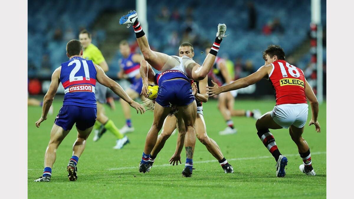  Eli Templeton of the Saints tackles and tumbles over Koby Stevens of the Bulldogs during the round two AFL NAB Challenge Cup match between the Western Bulldogs and the St Kilda. Picture: GETTY IMAGES