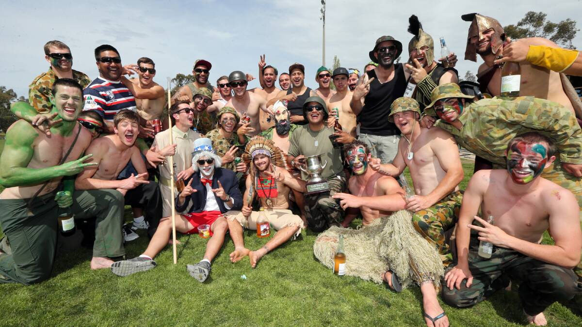 Albury Thunder players get together at Greenfield Park in fancy dress yesterday to celebrate Sunday’s grand final win. 