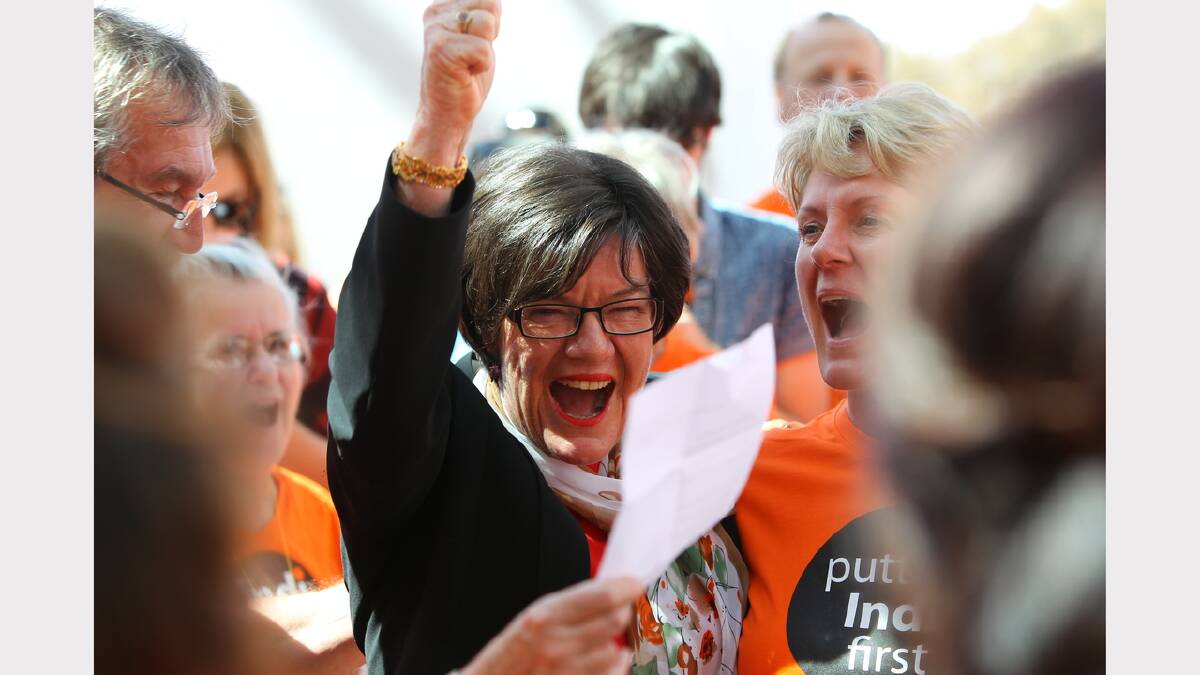 Member for Indi Cathy McGowan cheers with her supporters outside Parliament House on the day of her maiden speech. Picture: MATTHEW SMITHWICK