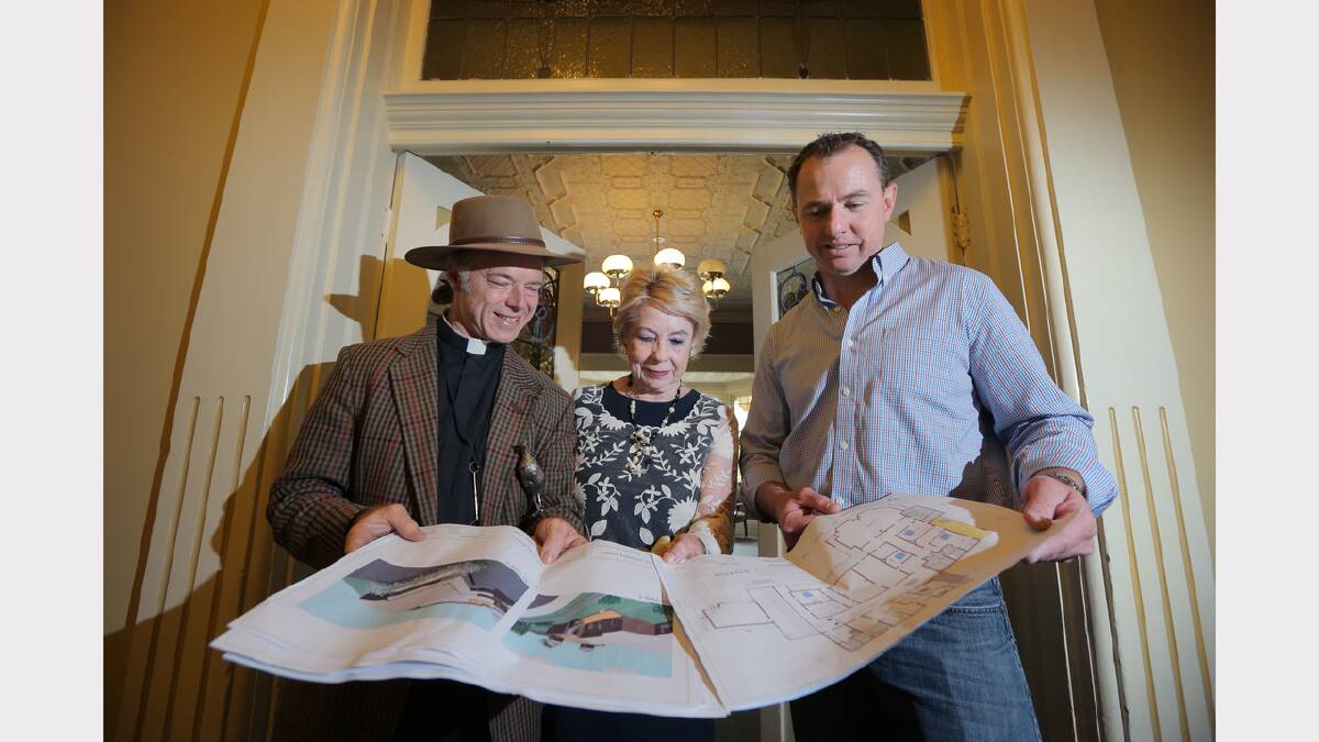 Father Peter Macleod-Miller , Sandra Macleod-Miller and Davis Sanders project manager Rory Nelson look over the plans for the renovations to make Adamshurst a residential home again.