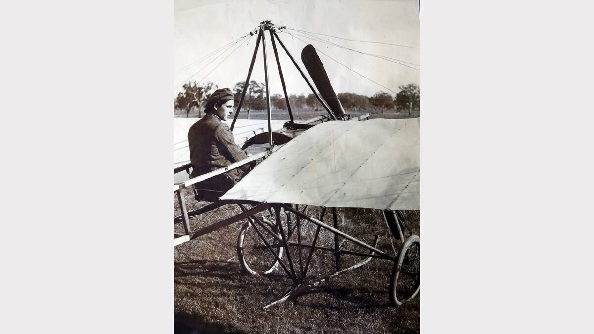 One of the photos of the original plane with Alex Porter at the controls.