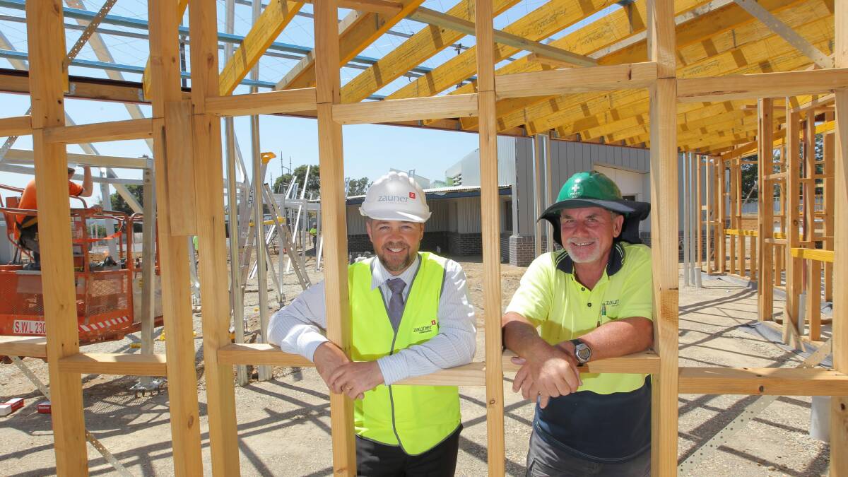 Belvoir principal Jamie Gay and site manager Max Wright in the new multi-purpose building, which is under construction. Picture: DAVID THORPE