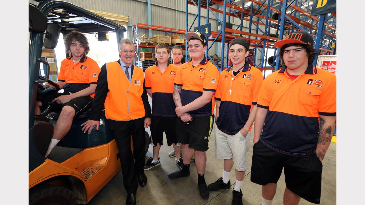 Trainee forklift drivers Corri Drew, Jacob Noack, Jake Macklan, Shane Bownds and Eric Chew with the Minister for Higher Education and Skills, Peter Hall.
