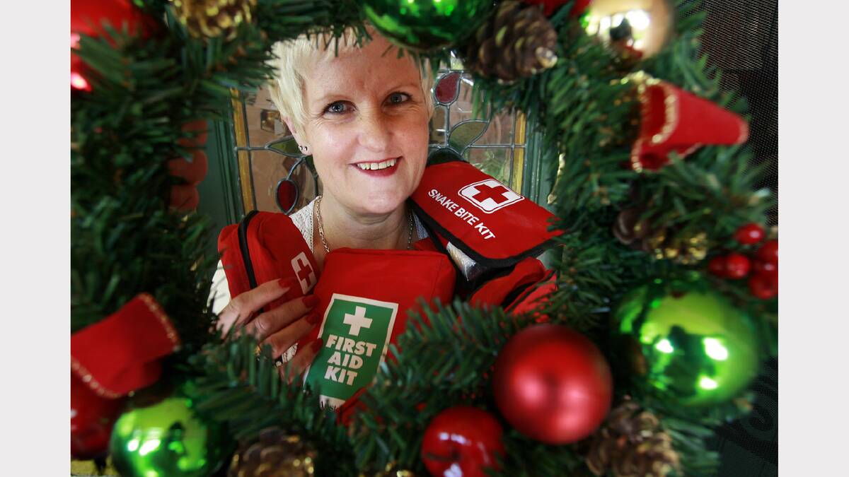 Red Cross regional secretary Simone Eldridge with first aid kits the organisation is encouraging people to buy as Christmas presents. Picture: KYLIE ESLER