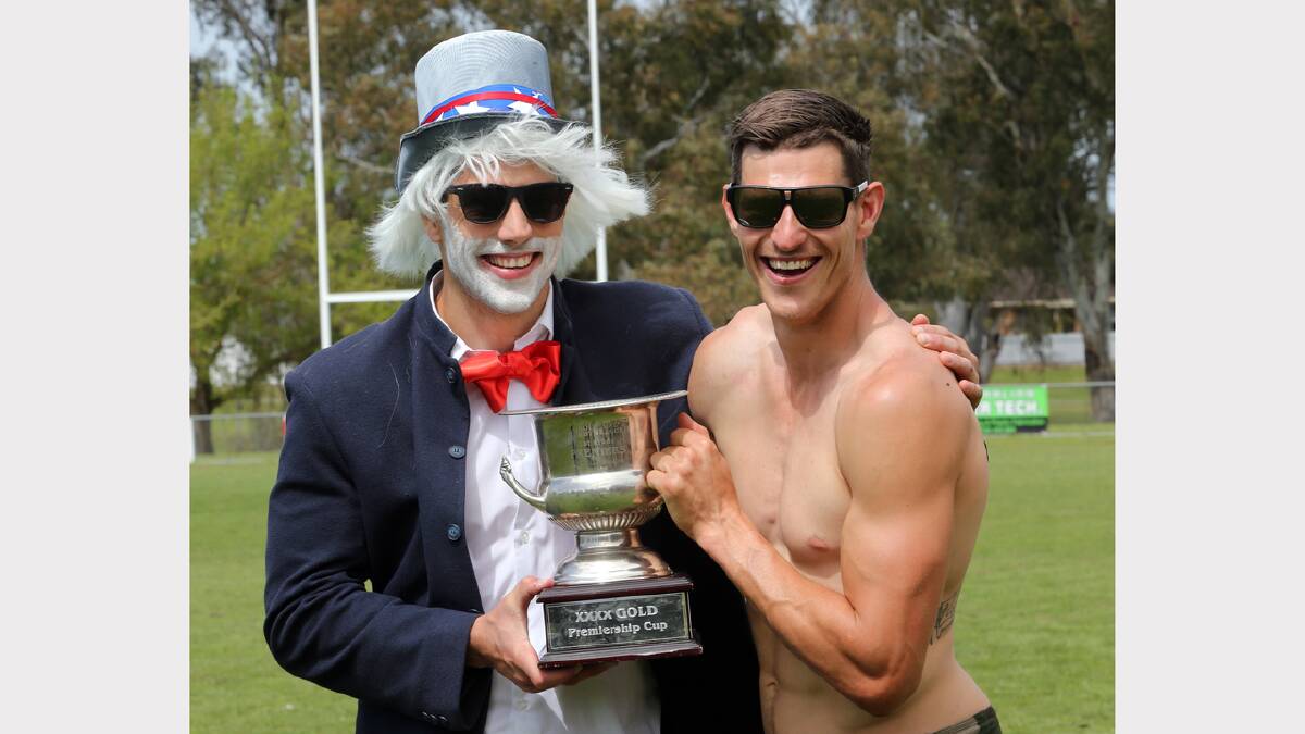 Brothers Mitch and Chris Seaton show off the premiership cup during the Thunder’s Mad Monday celebrations.