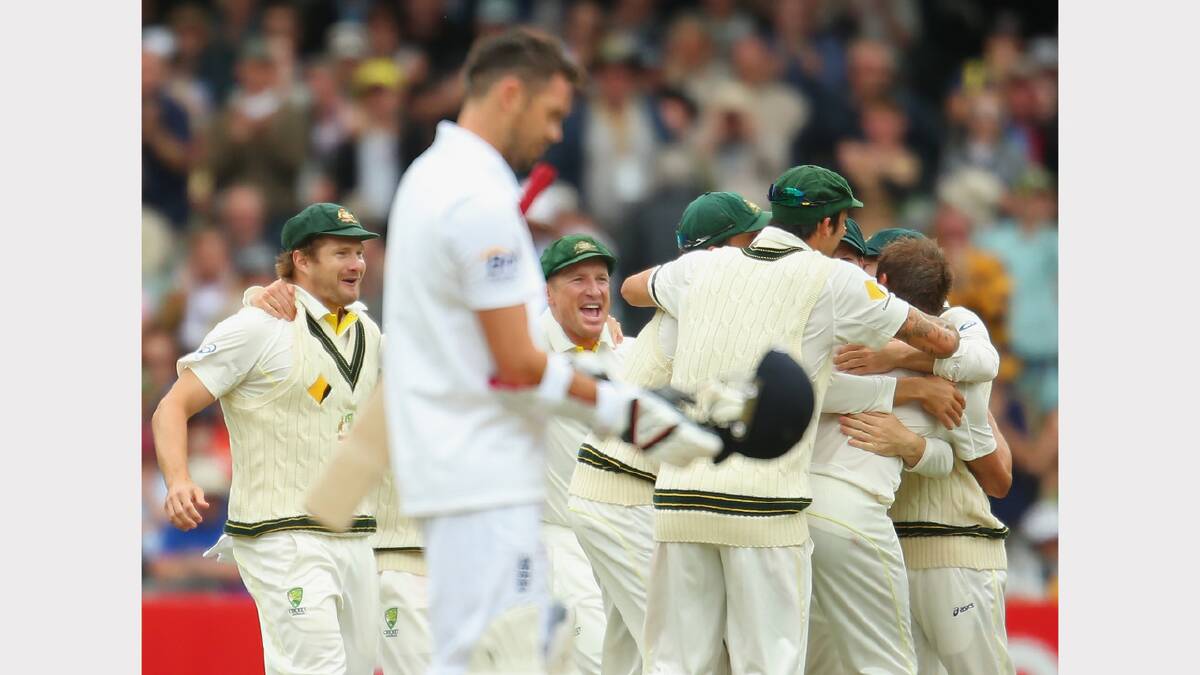 Shane Watson, Brad Haddin and the Australians celebrate as they win the match as James Anderson of England looks on. Picture: GETTY IMAGES