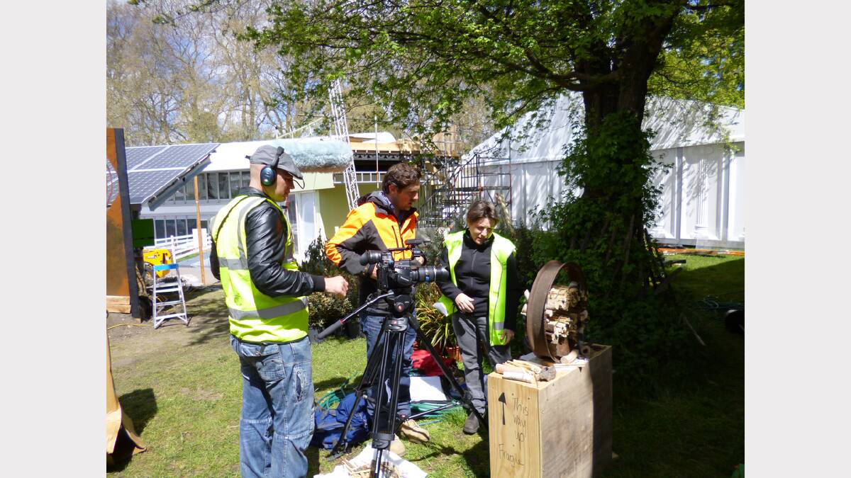   Workers put together Joanne Diver's sculpture at the Chelsea Flower Show.