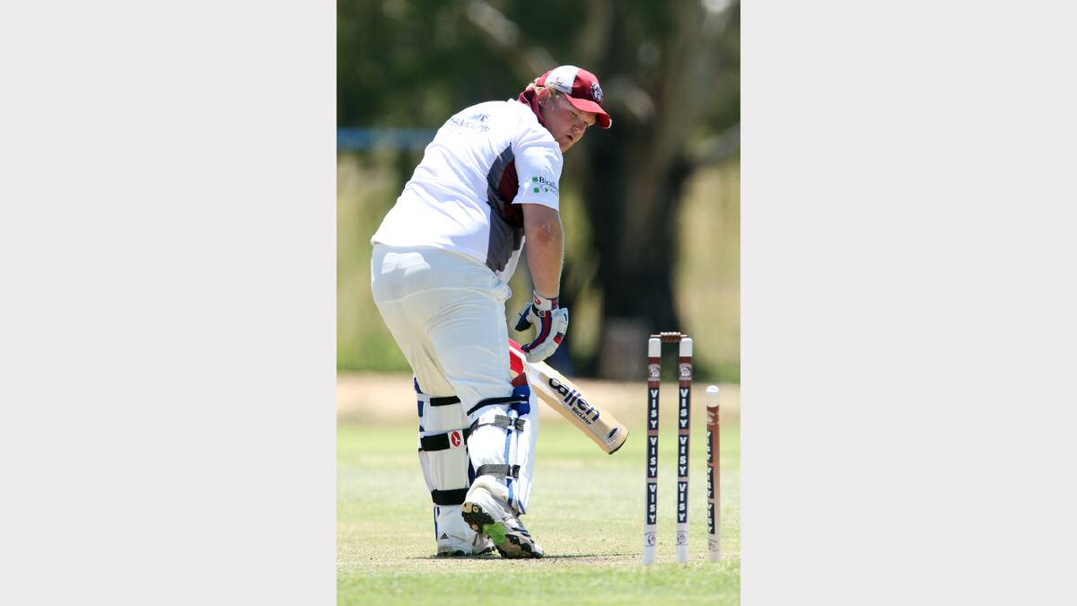 Wodonga's Sean Lappin looks back at his stumps after being bowled out.