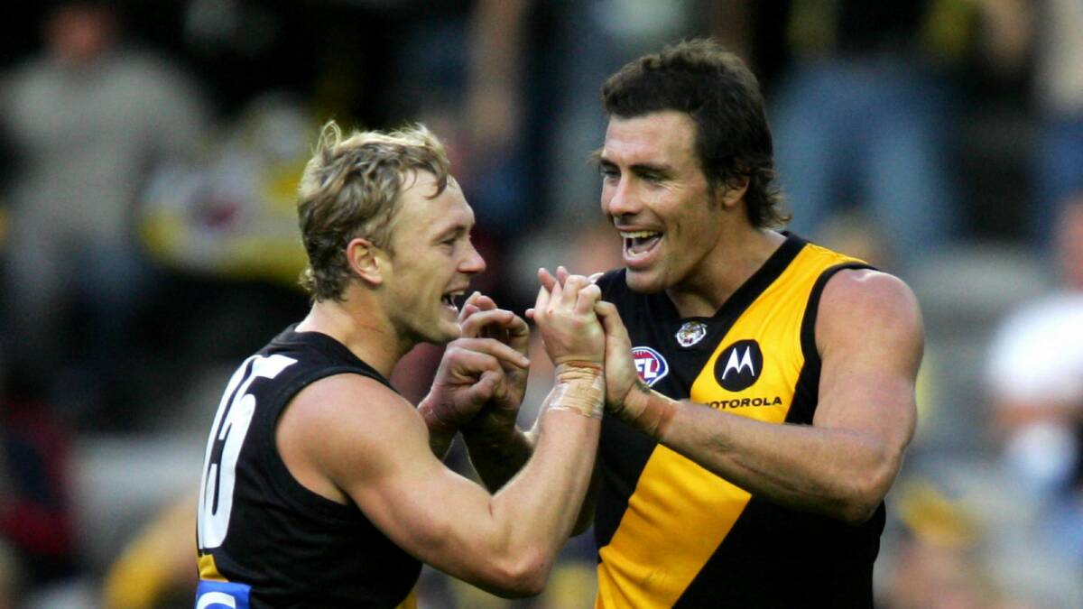 Kayne Pettifer and Matthew Richardson  celebrate a goal against Port Adelaide. Picture: FAIRFAX