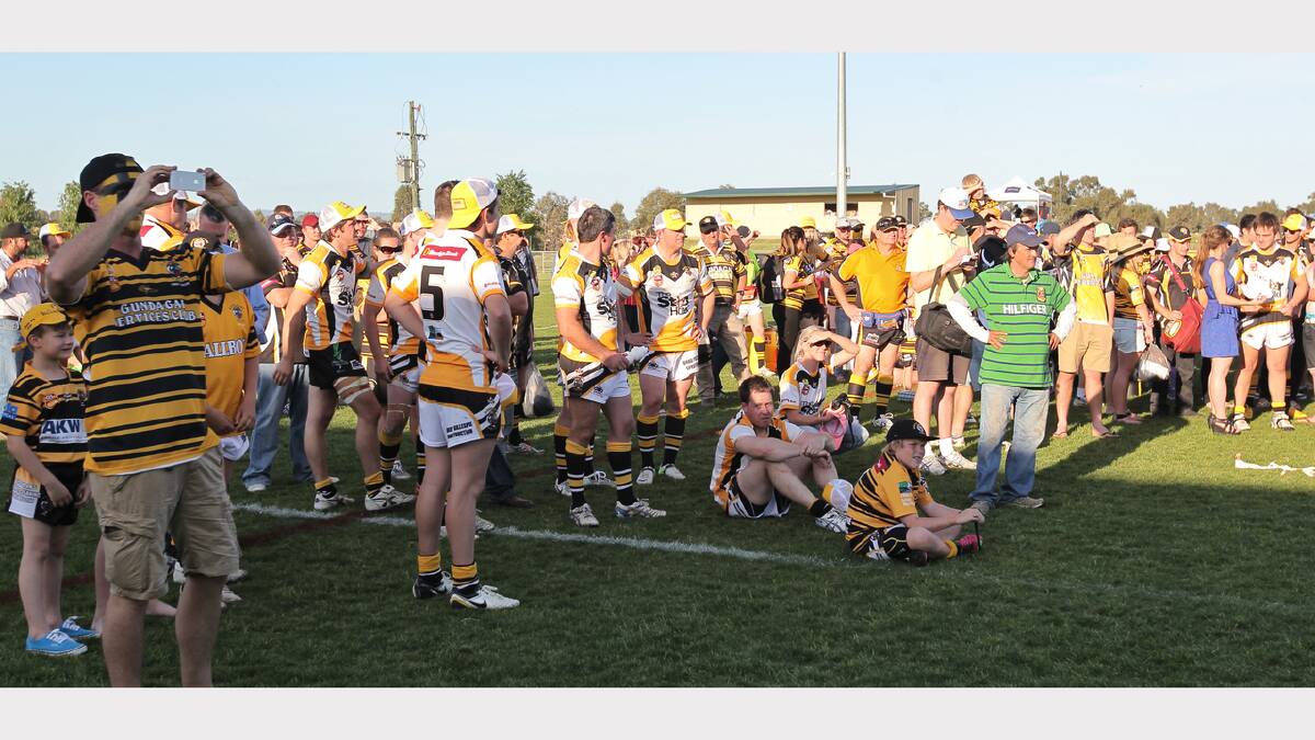Disappointed Gundagai boys gather after the match. 