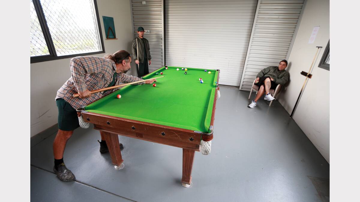  Inmates playing pool.