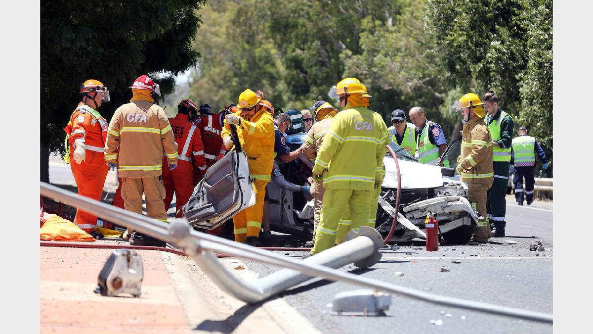 Emergency services worked to rescue the trapped woman from her car. 