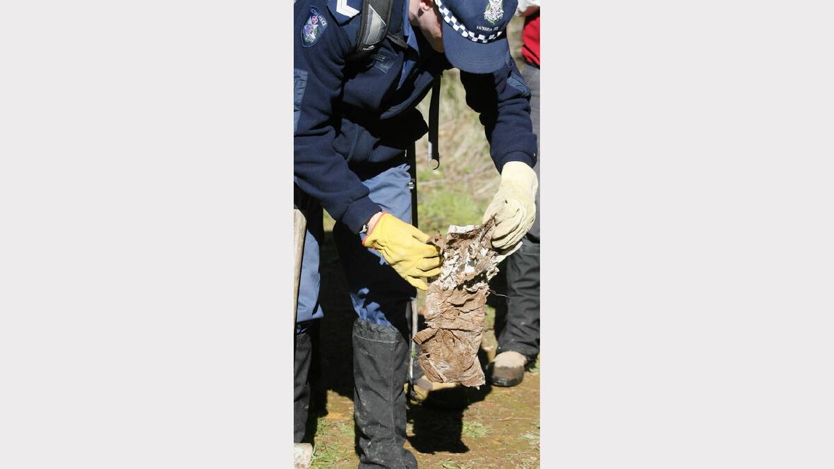 2007 - Police examine a nappy found near Slaughteryard Creek Road in day 3 of a search for Daniel Thomas' body. 