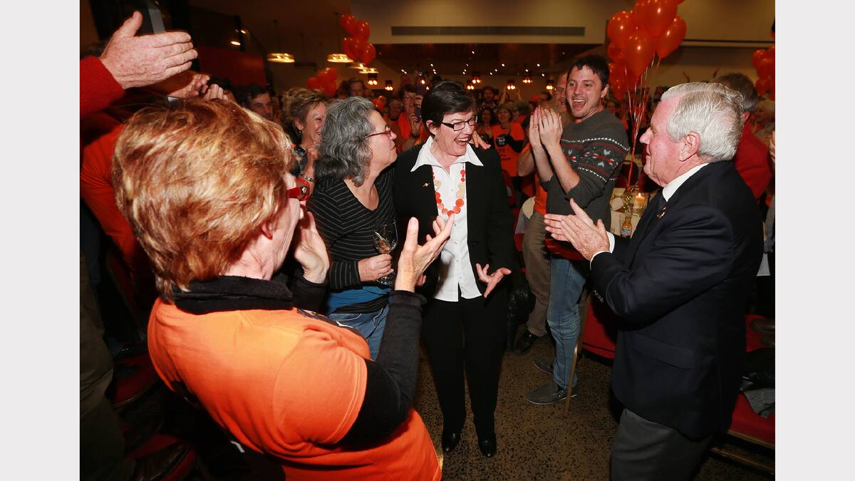 Cathy McGowan celebrates with Ken Jasper as her apparent victory over Sophie Mirabella for the seat of Indi unfolds on election night. “After a very public campaign she is greeted by a horde of orange-clad supporters,” Russell says. “It has been amazing to witness. The level of interest and intrigue that has developed during the campaign is amazing after years of political stagnation.”
