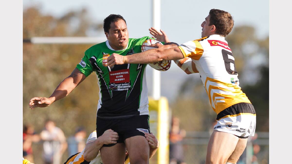 Albury's Willie Heta is tackled high and low.