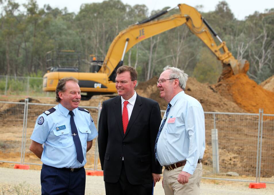 Hume prisons region general manager Terry Jose, Minister for Corrections and Prime Prevention Edward O'Donohue and Indigo Shire mayor Bernard Gaffney discussing the expansion going on at Beechworth Correctional Centre. Pictures: MATTHEW SMITHWICK