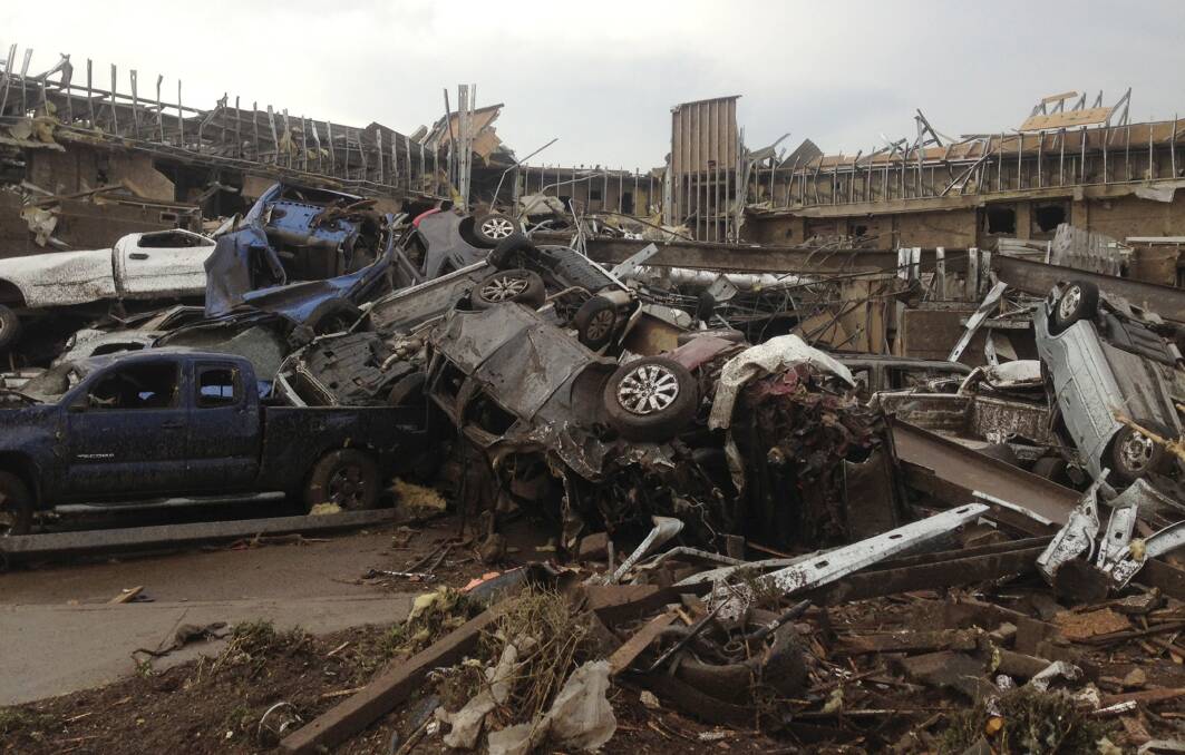 Overturned cars litter the streets of Oklahoma City after a deadly tornado swept through the area. Photo: REUTERS