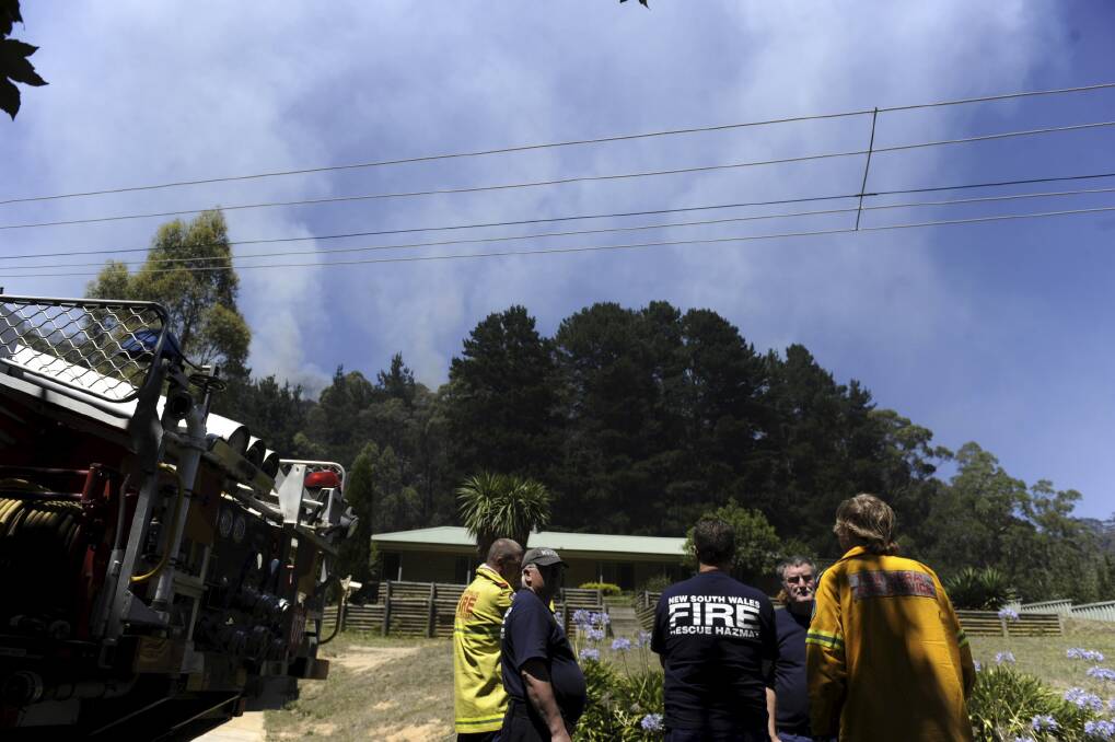NSW firemen doing property protection at a brushfire at Berry St, Lithgow. January 9, 2013. Photo by Mick Tsikas