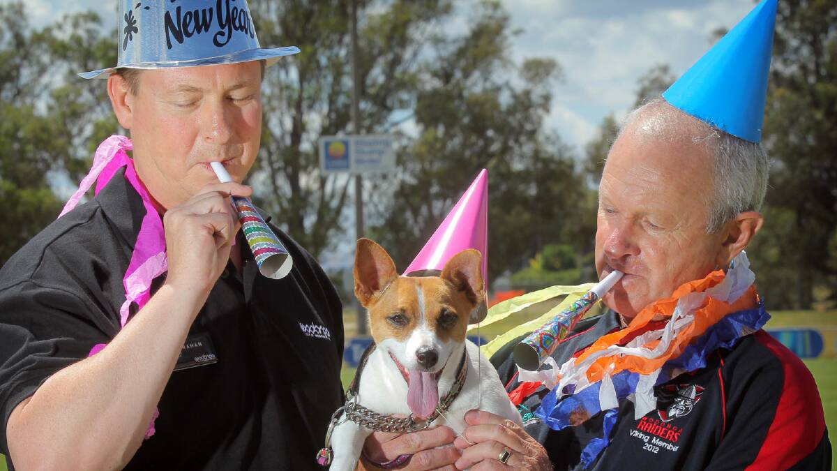 Wodonga Council’s Craig McClanahan and Wodonga Raiders’ Greg Dawson are urging people to look after their pets on New Year’s Eve, especially dogs like Lily the Jack Russell. Picture: TARA GOONAN