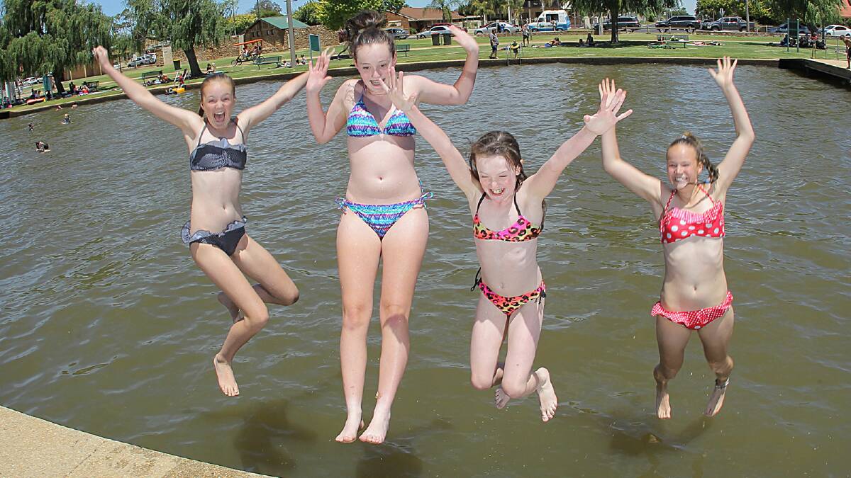 Kelsey Mason, 12, of Albury, Kara, 15, and Taylah Farrow, 9, of Shepparton, and Courtney Mason, 14, of Albury, cool off in Lake Mulwala. The region is expecting a run of temperatures in the high 30s and low 40s. Picture: TARA GOONAN