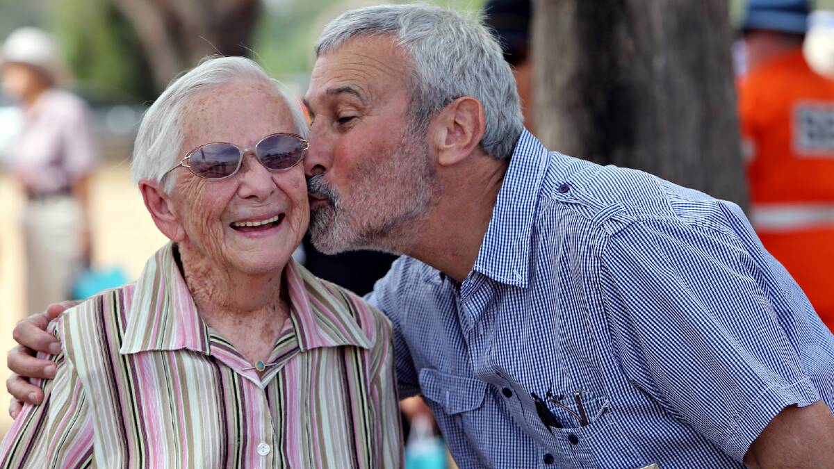Greater Hume Shire Citizen of the Year Nancy Lee receives a kiss from Australia Day ambassador Don Burke. Mrs Lee is a volunteer with Red Cross, the RSL, Meals on Wheels and Probus. Pictures: KYLIE ESLER