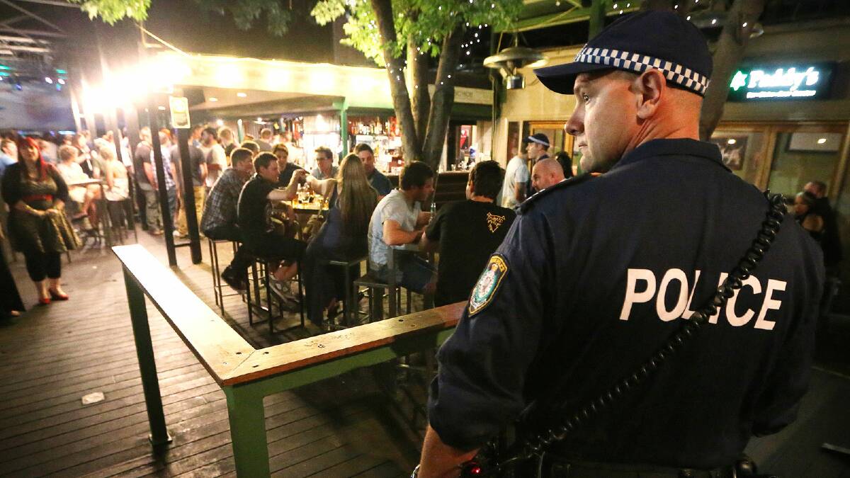 Sgt Mark Watson on a 'walk through' at Paddy's on Friday night. Picture: JOHN RUSSELL