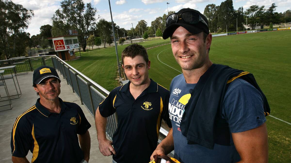 Sam Carpenter and Karl Norman with Hawks coach Mick Caruso. Picture: BEN EYLES